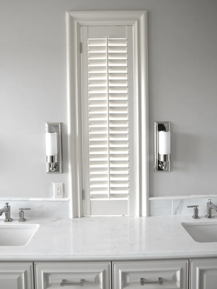 white bathroom plantation shutters