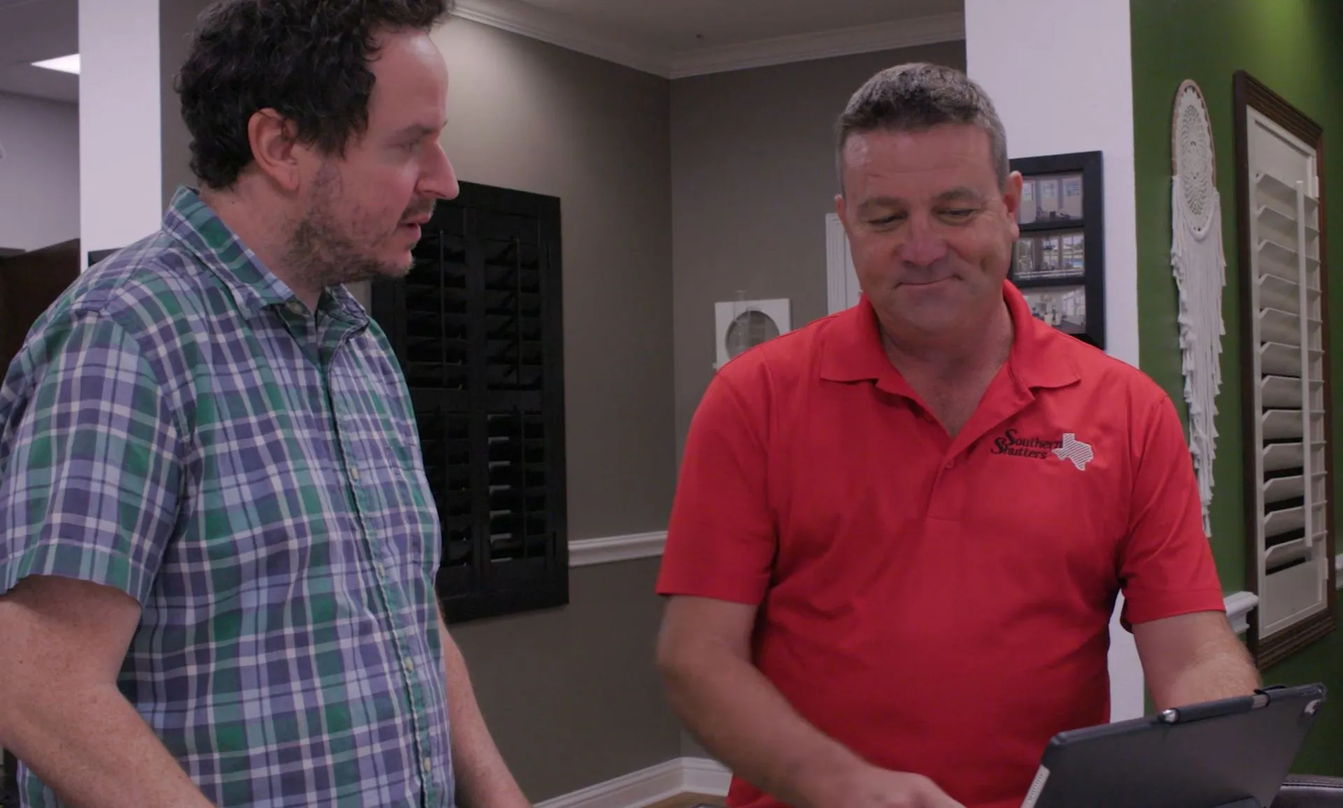 Southern Shutters factory rep showing a demo of shutter louvers